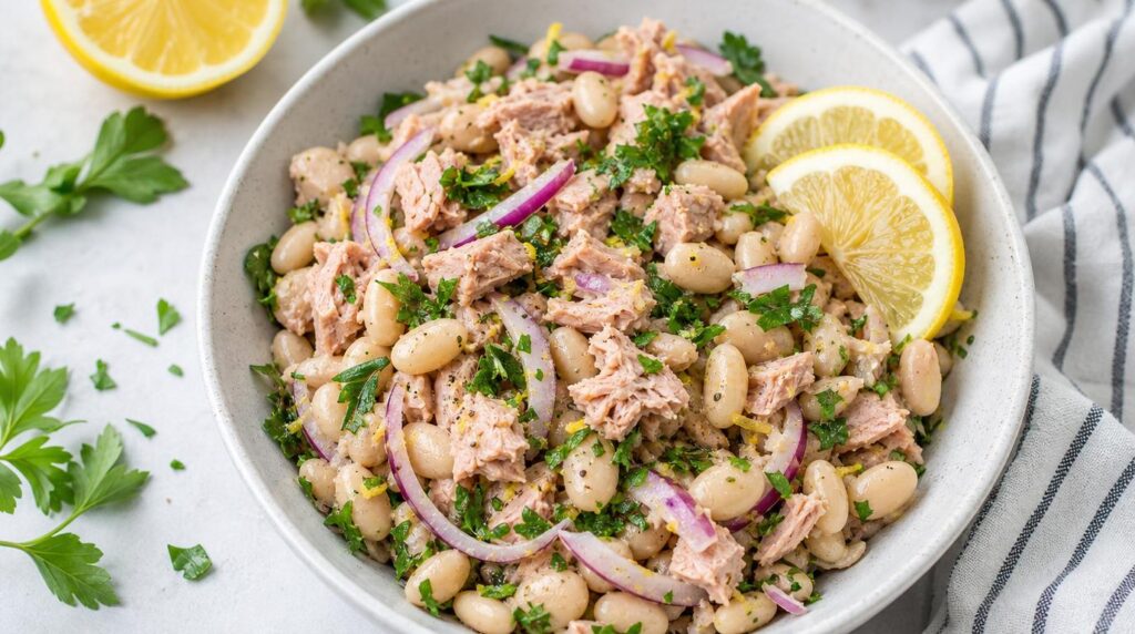 White Bean and Tuna Salad bowl with white beans, tuna, red onion, parsley and lemon